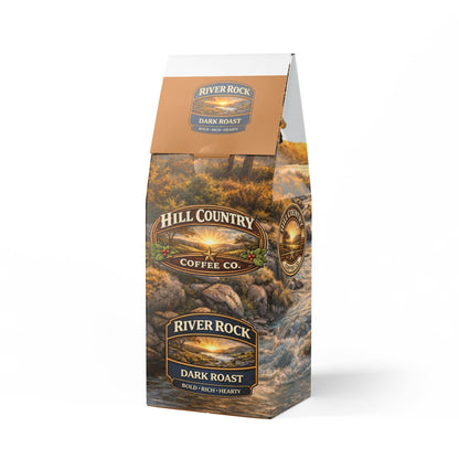Hill Country Coffee Co. River Rock Dark Roast coffee bag with scenic design on a white background
